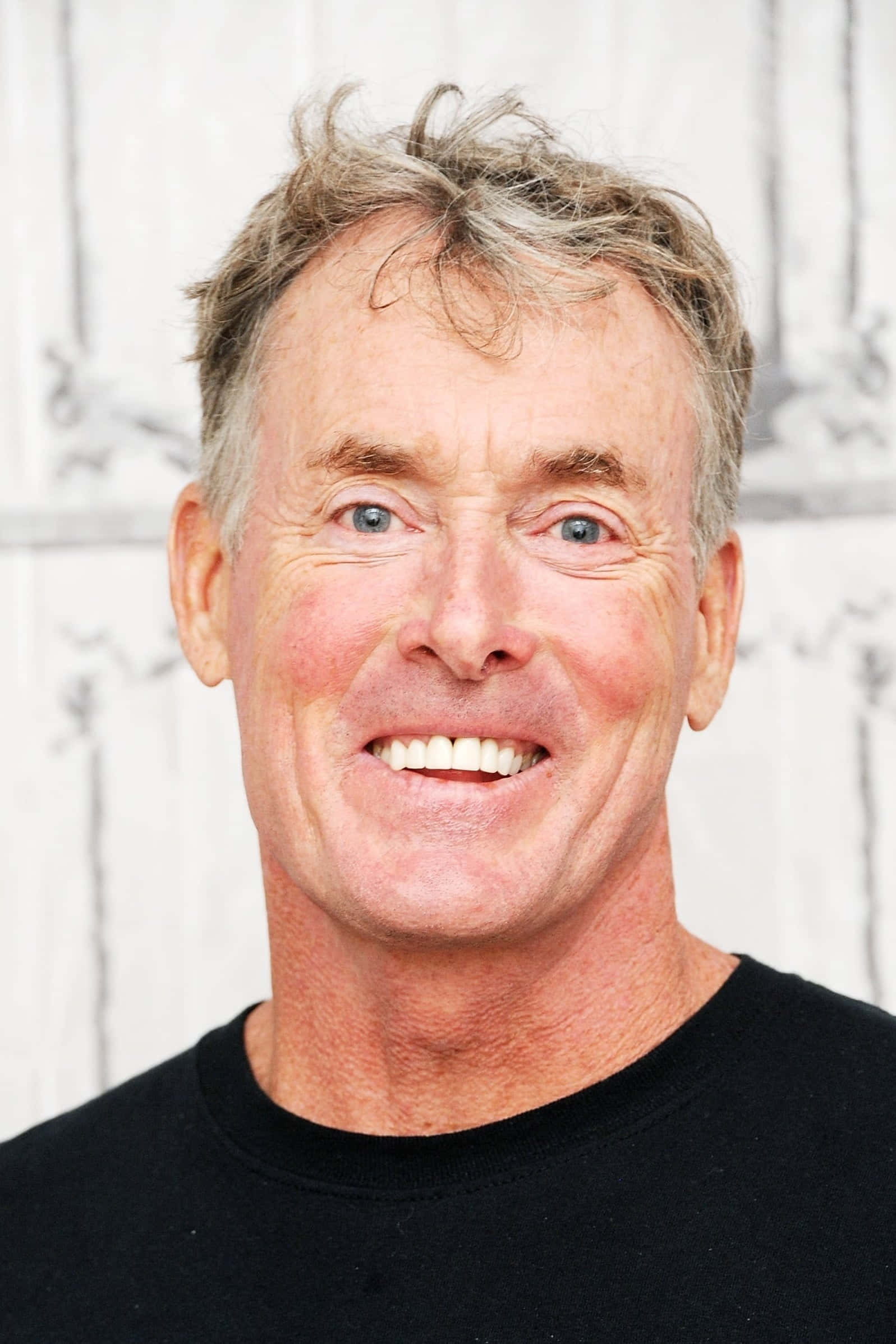 John C. Mcginley Posing For A Photoshoot Wallpaper