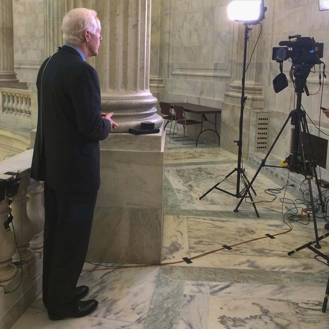 John Cornyn In Front Of A Camera Wallpaper