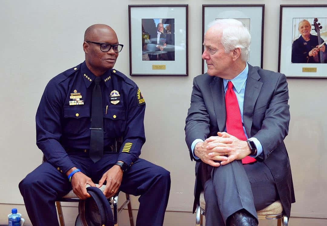 John Cornyn Talking To An Officer Wallpaper