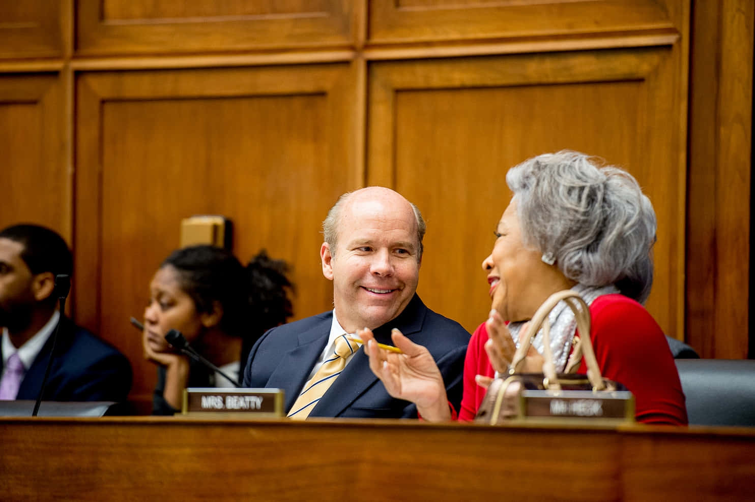 John Delaney Engaging In A Passionate Conversation Wallpaper