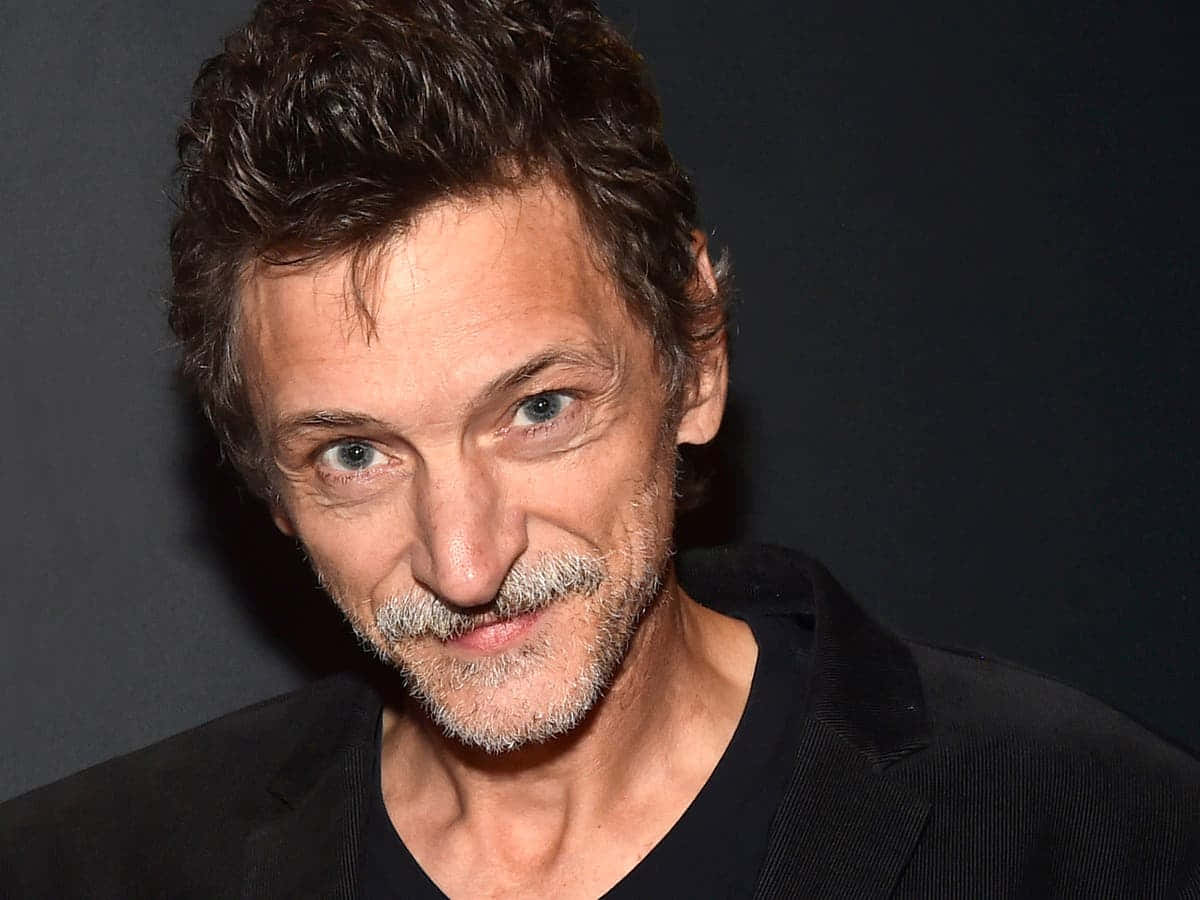 John Hawkes Posing At A Photo Shoot Wallpaper