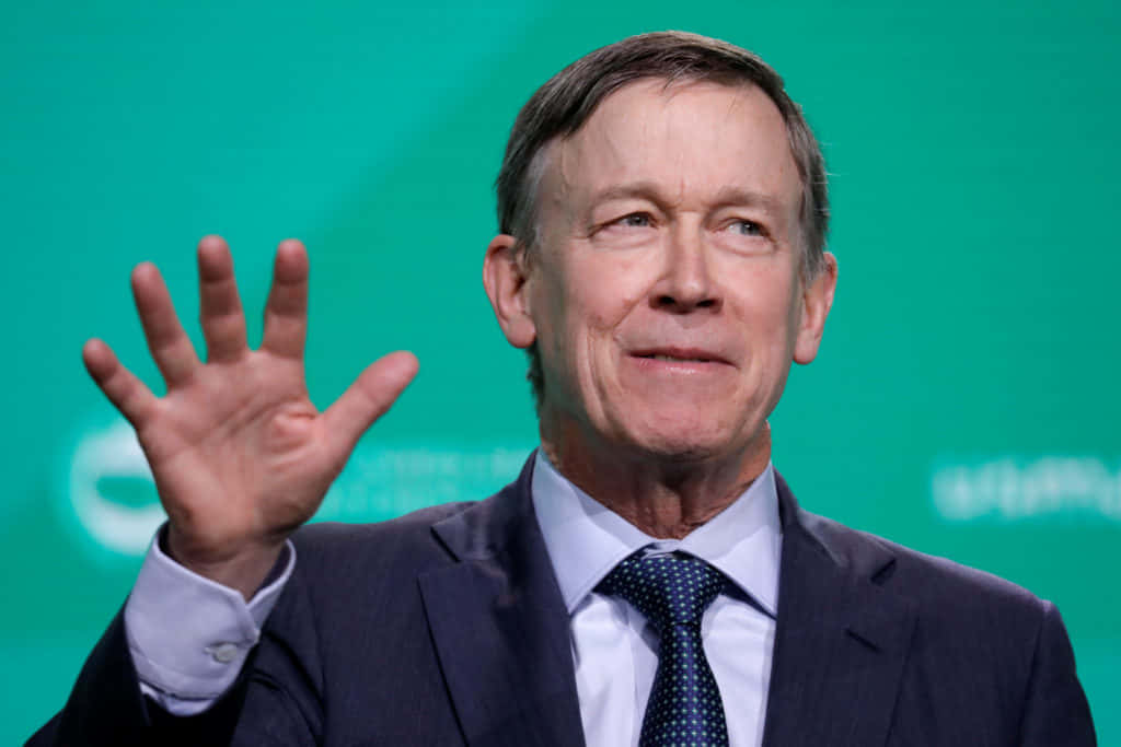 John Hickenlooper With A Cyan Background Wallpaper