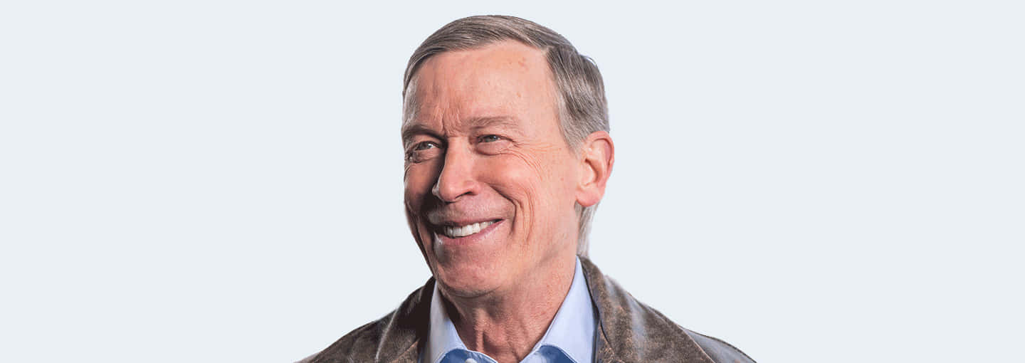 John Hickenlooper With A White Backdrop Widescreen Wallpaper