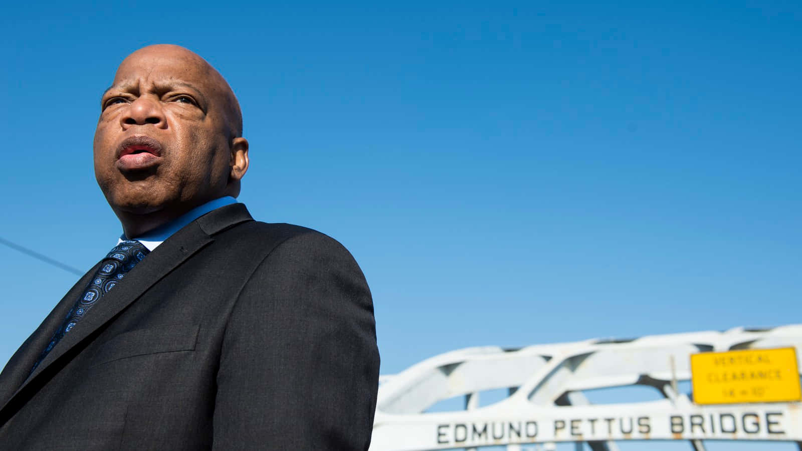 John Lewis Standing On The Edmund Pettus Bridge Wallpaper