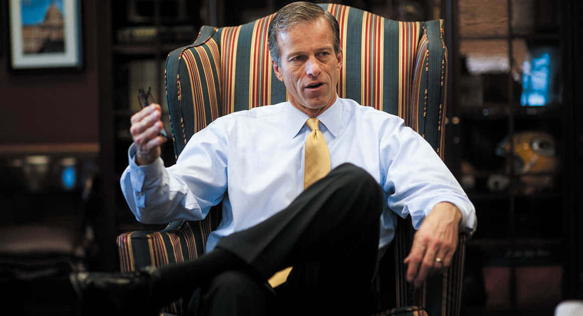 John Thune On A Striped Chair Wallpaper