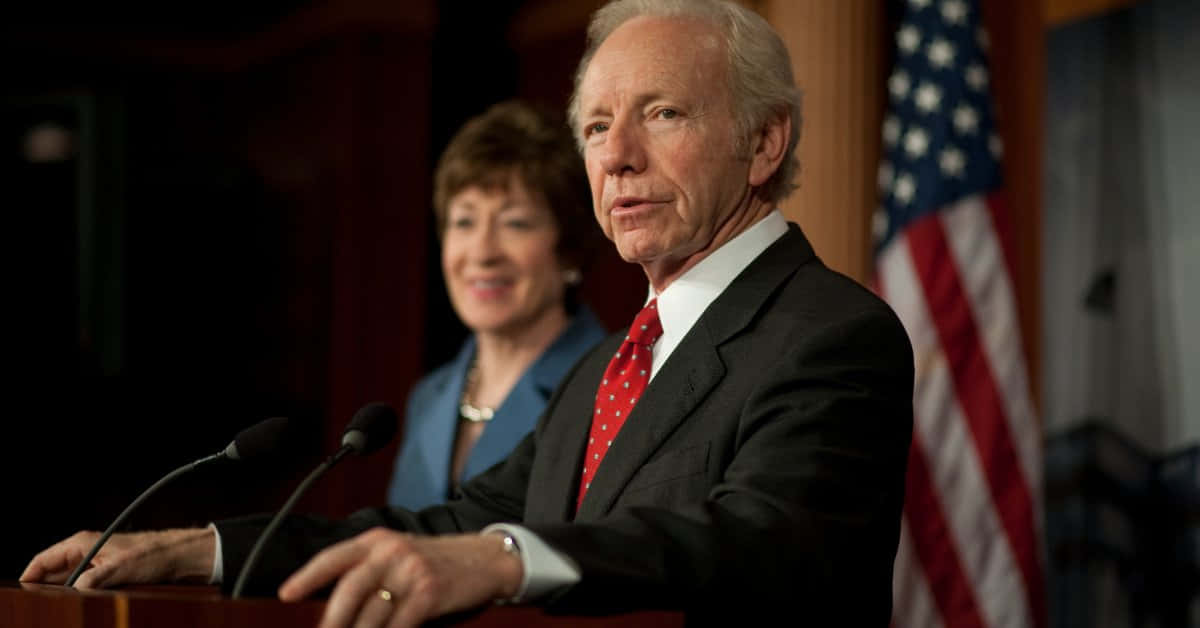 Joseph Lieberman Giving A Speech At An Event Wallpaper