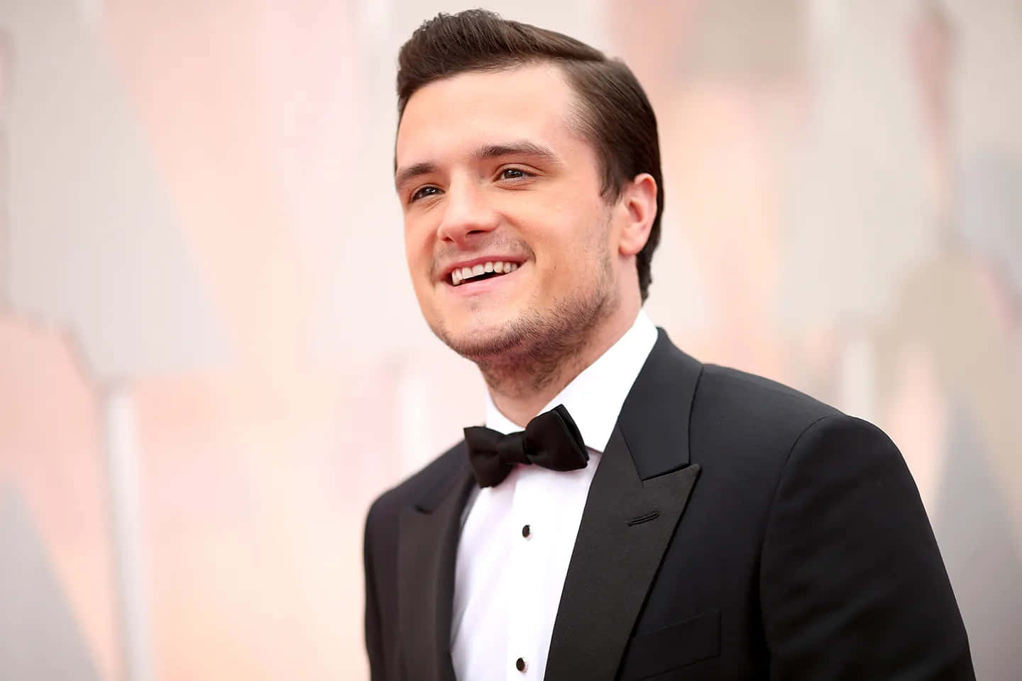 Josh Hutcherson Smilingin Tuxedoat Event.jpg Wallpaper