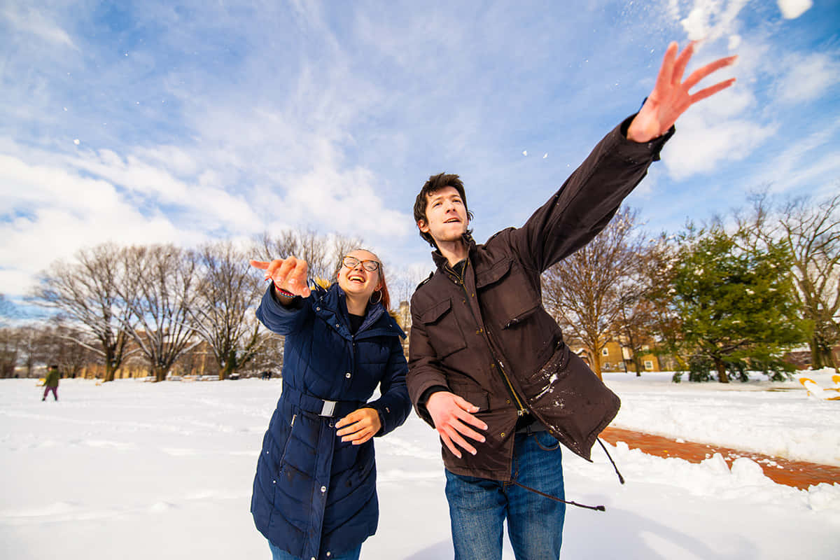 Joyful Snowball Fight Winter Fun.jpg Wallpaper