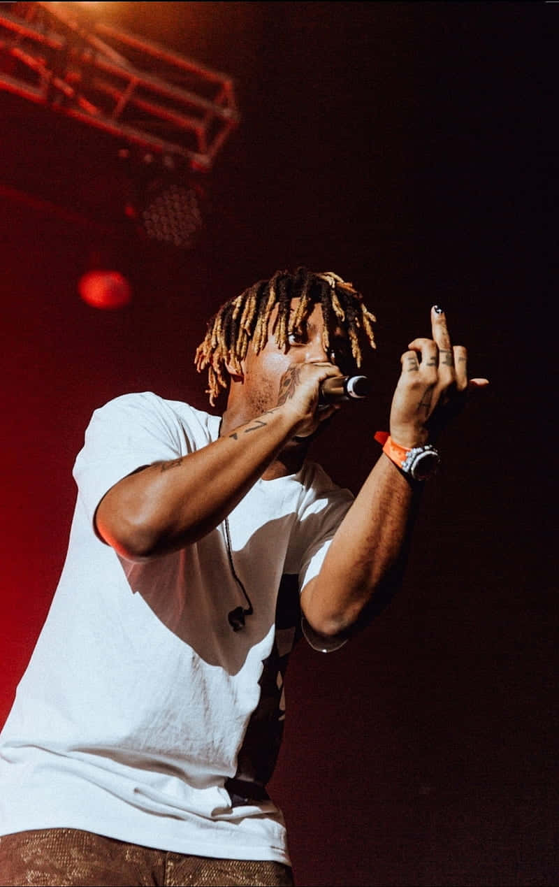 Juice Wrld Playing An Electrifying Show At A Concert Wallpaper