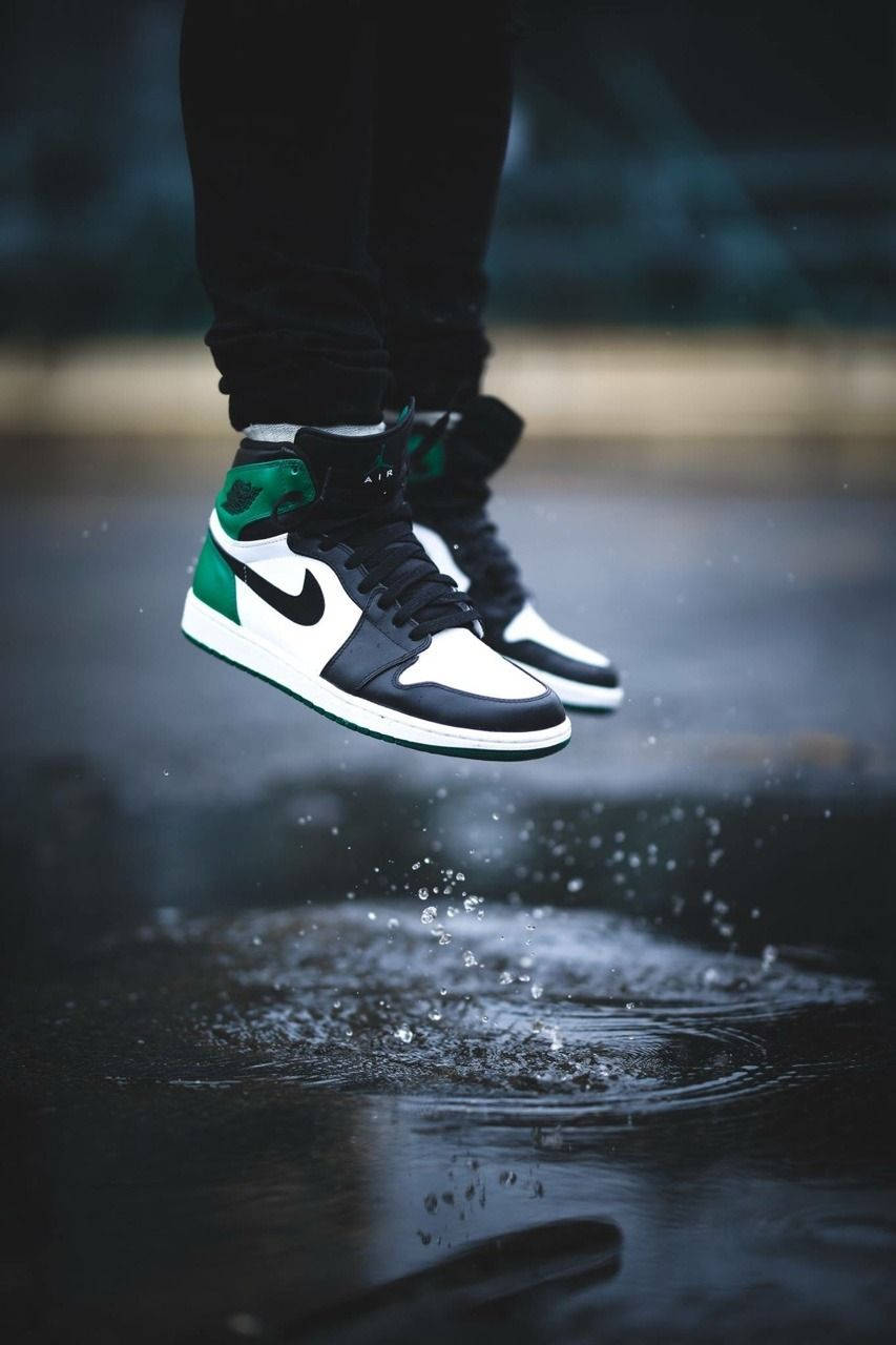 Jumping Person Wearing A Nike Air Jordan 1 Wallpaper