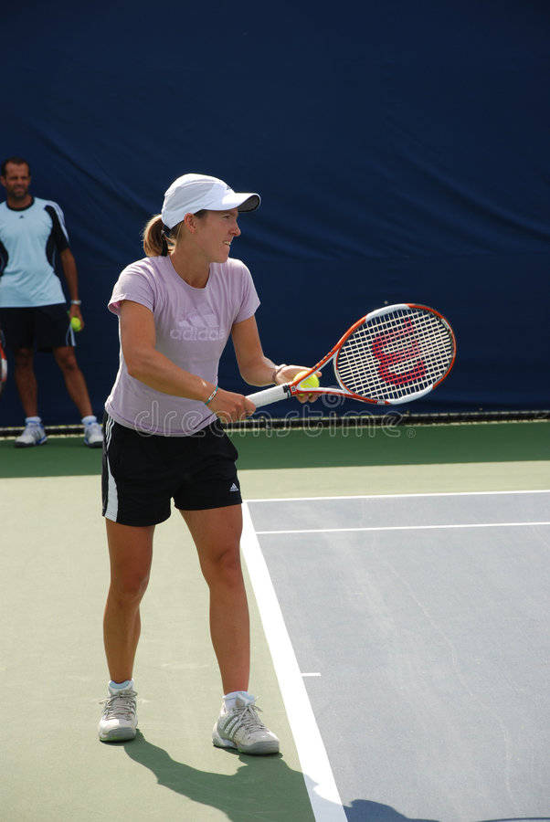 Justine Henin Showing Remarkable Skills On Tennis Court Wallpaper