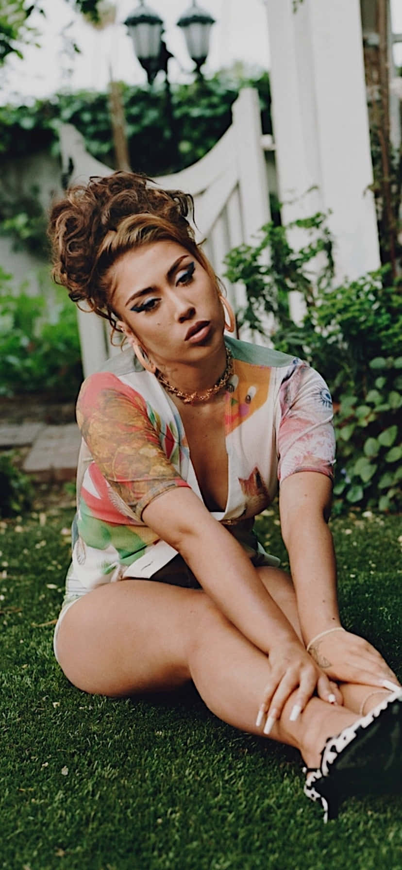 Kali Uchis Sitting Outdoor Portrait Wallpaper