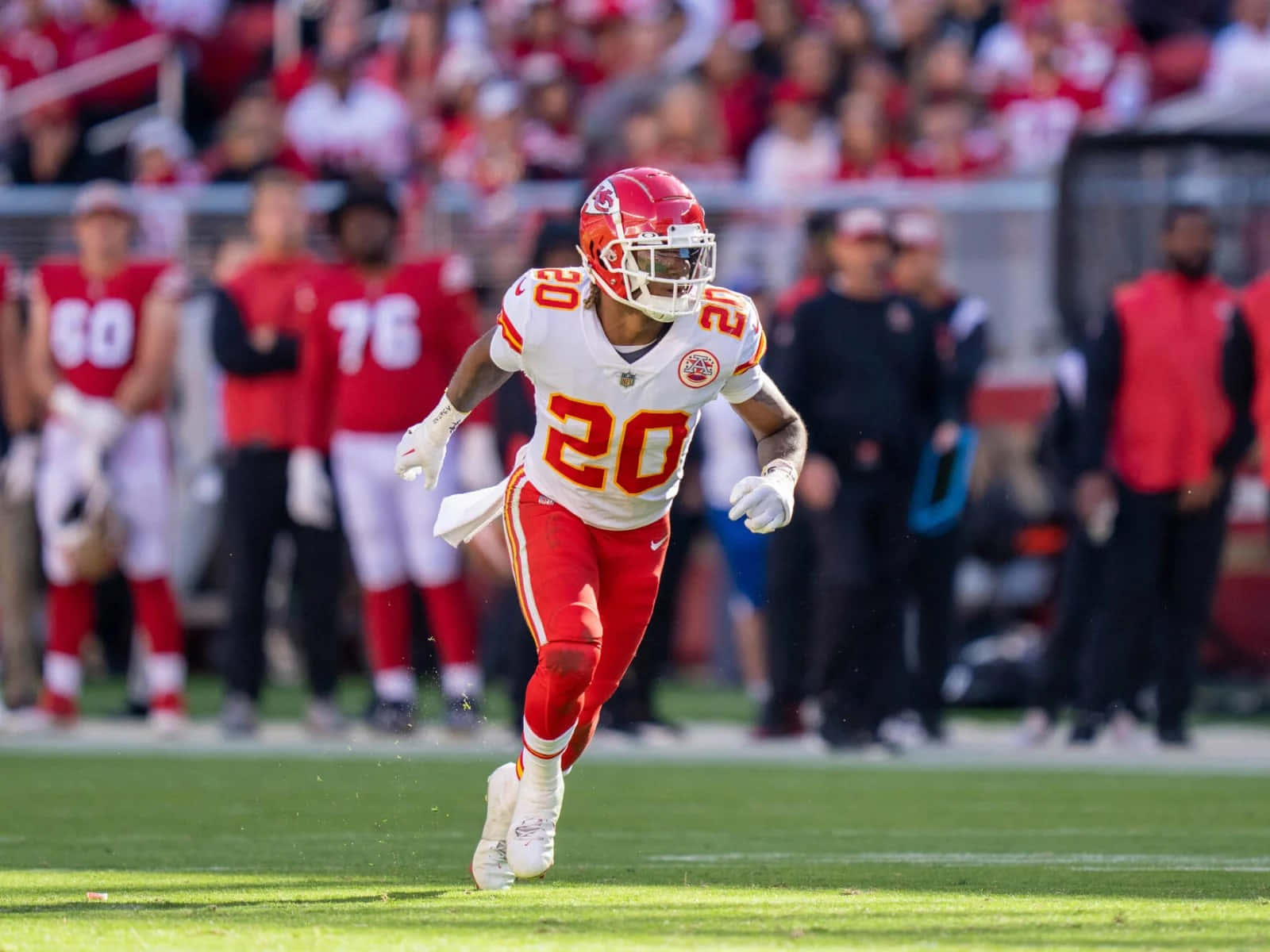 Kansas City Chiefs Player Running On Field Wallpaper