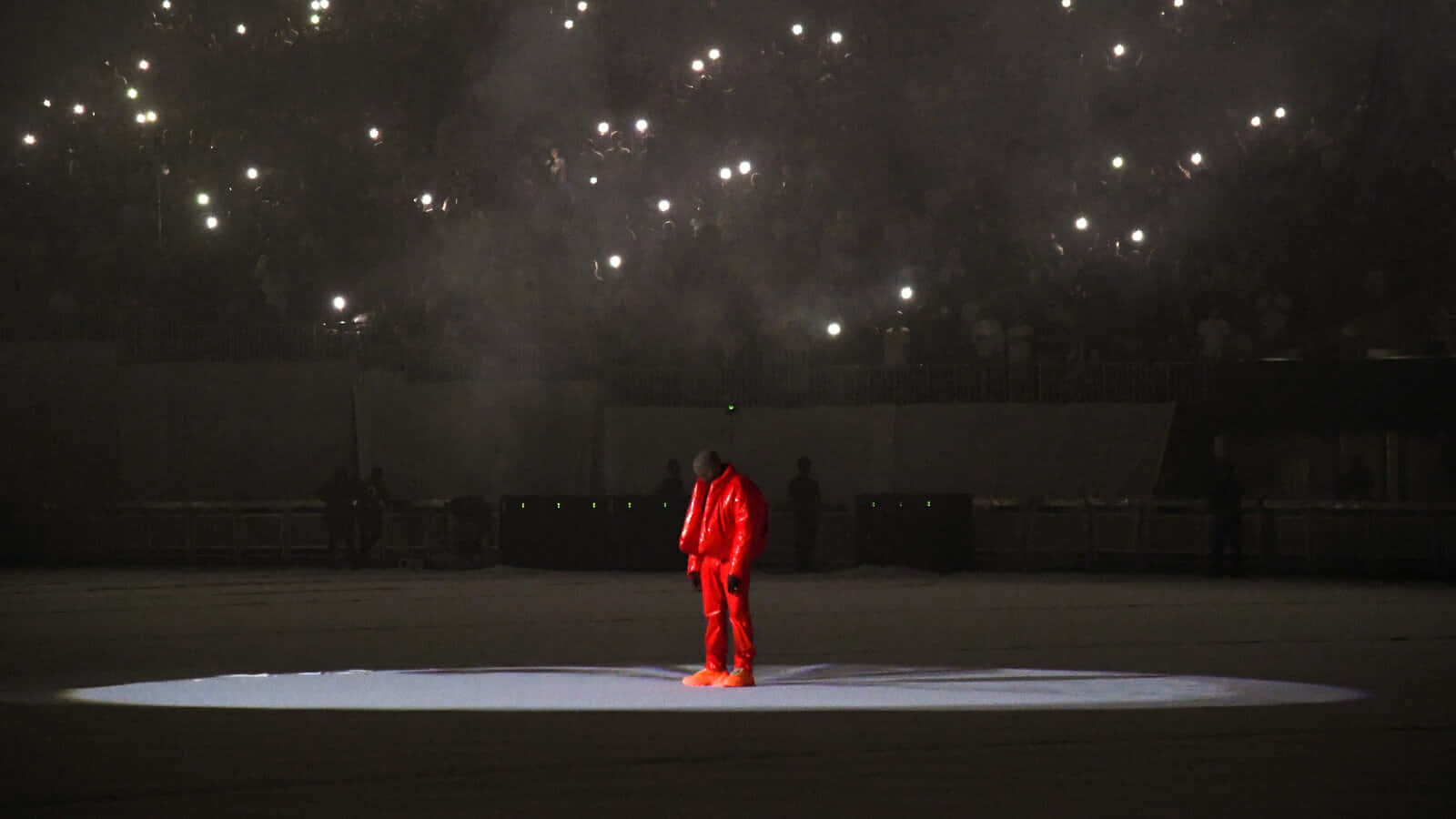 Kanye West Red Outfit Spotlight Performance Wallpaper