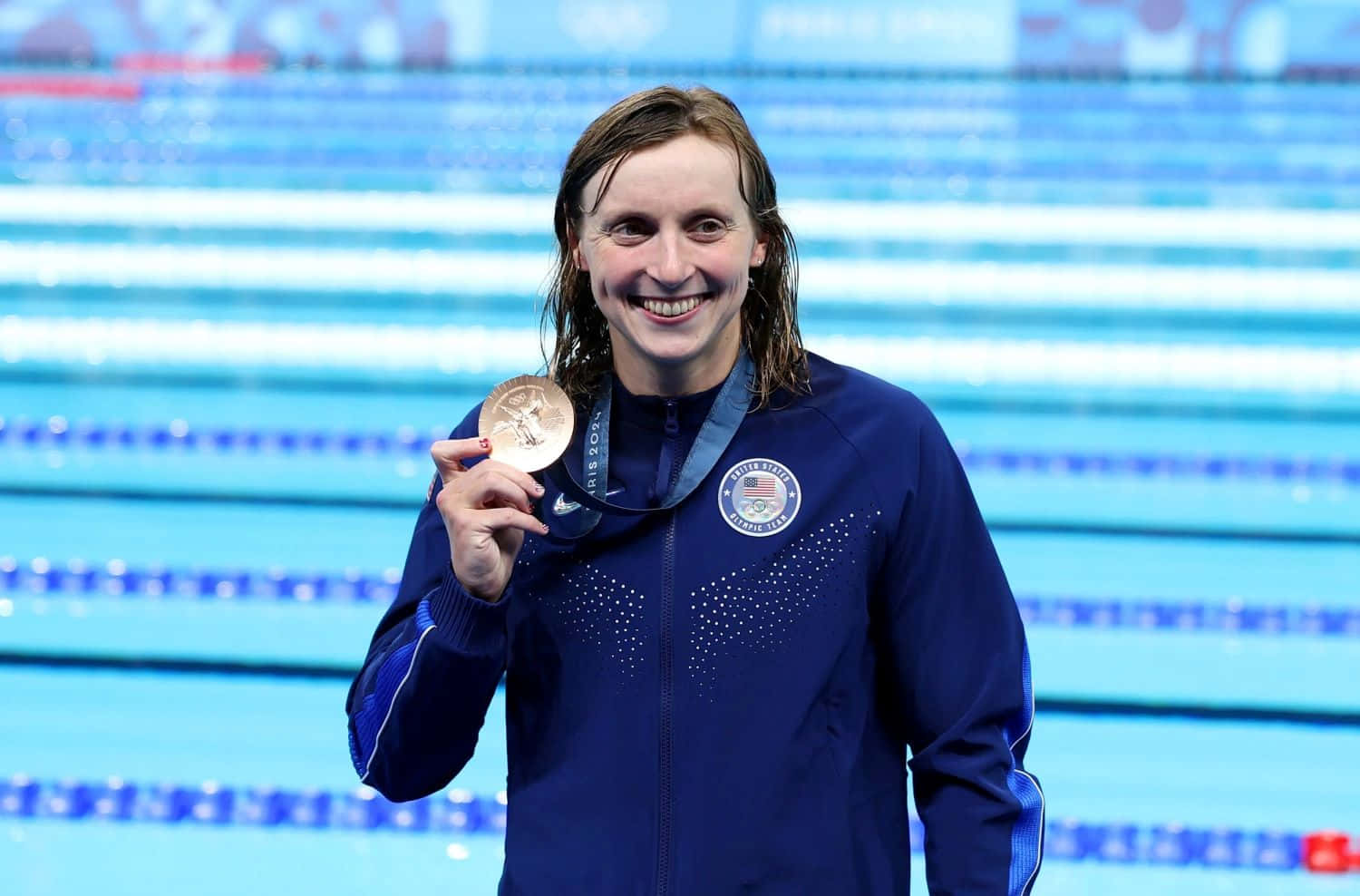 Katie Ledecky Celebratingwith Medal Wallpaper