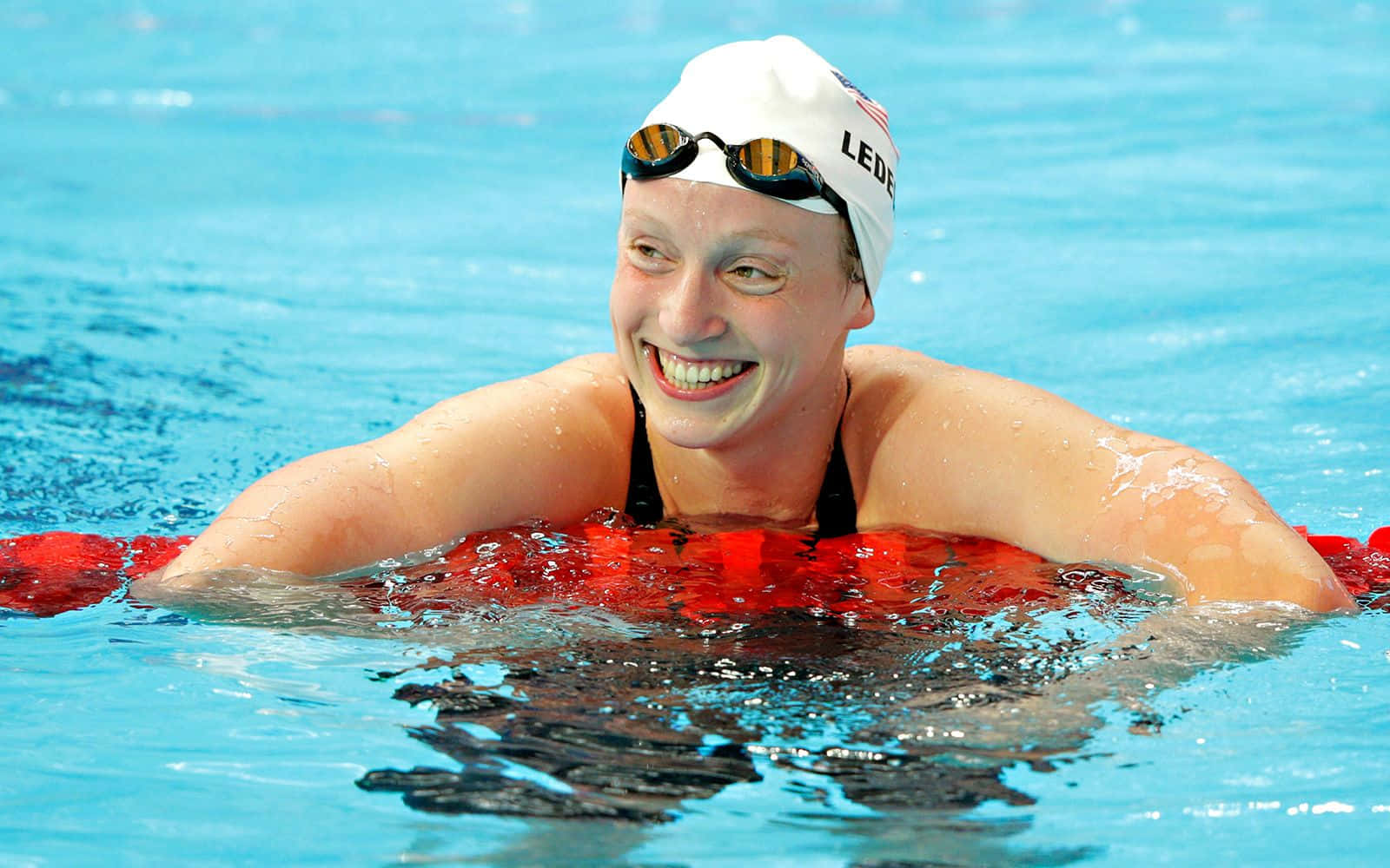 Katie Ledecky Smiling Swimmer Wallpaper