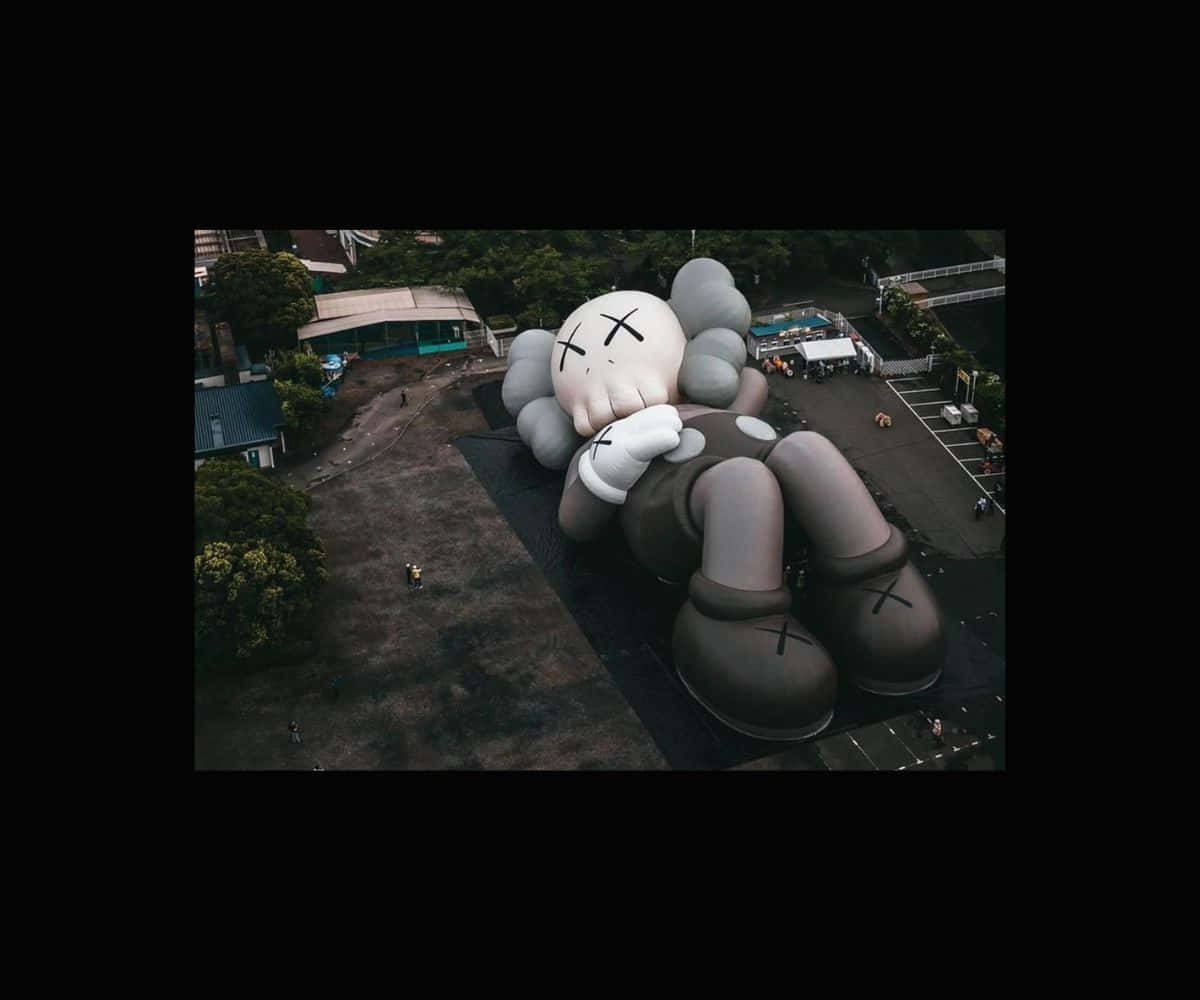 Kaws Holiday - A Journey Of Art And Adventure Wallpaper