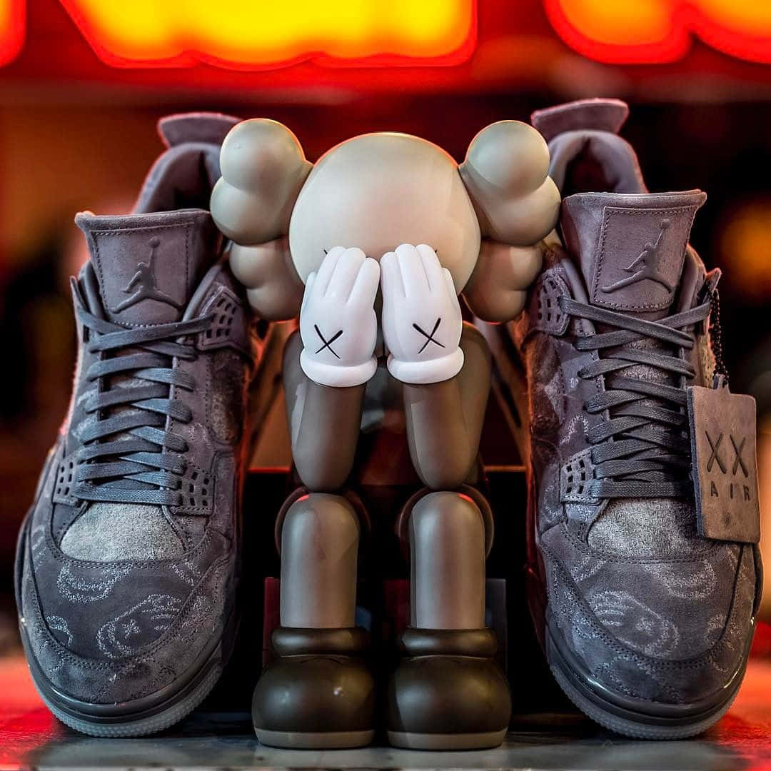 Kaws X Air Jordan Collaboration Sneakers Showcasing Streetwear Culture Wallpaper