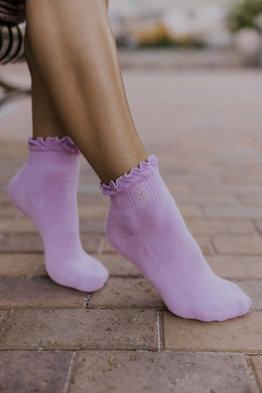 Keep Active And Stylish With These Cozy Purple Socks Wallpaper