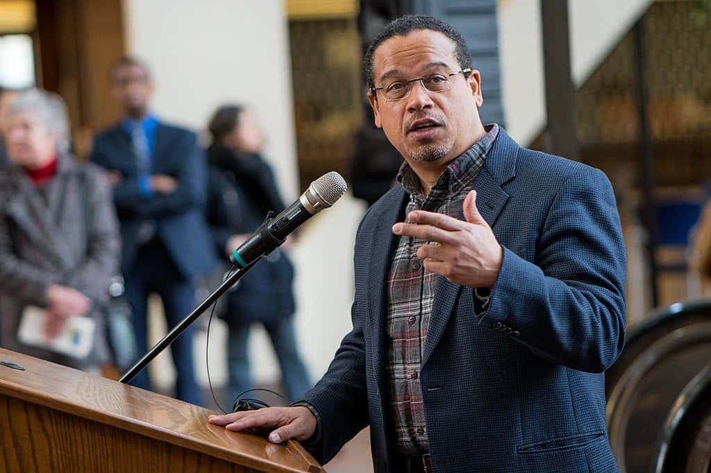 Keith Ellison Behind Lectern Wallpaper