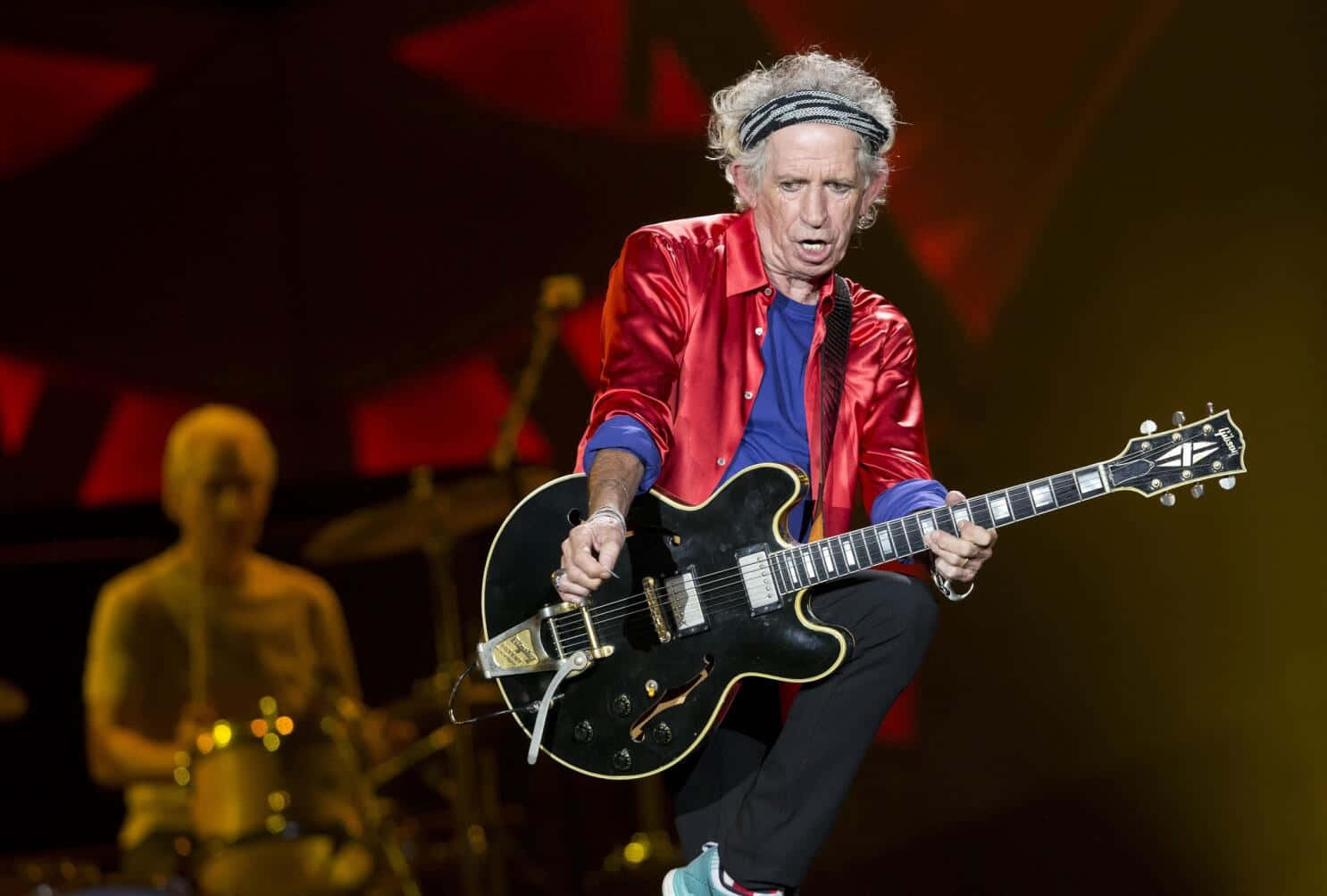 Keith Richards Red Jacket Guitar Performance Wallpaper