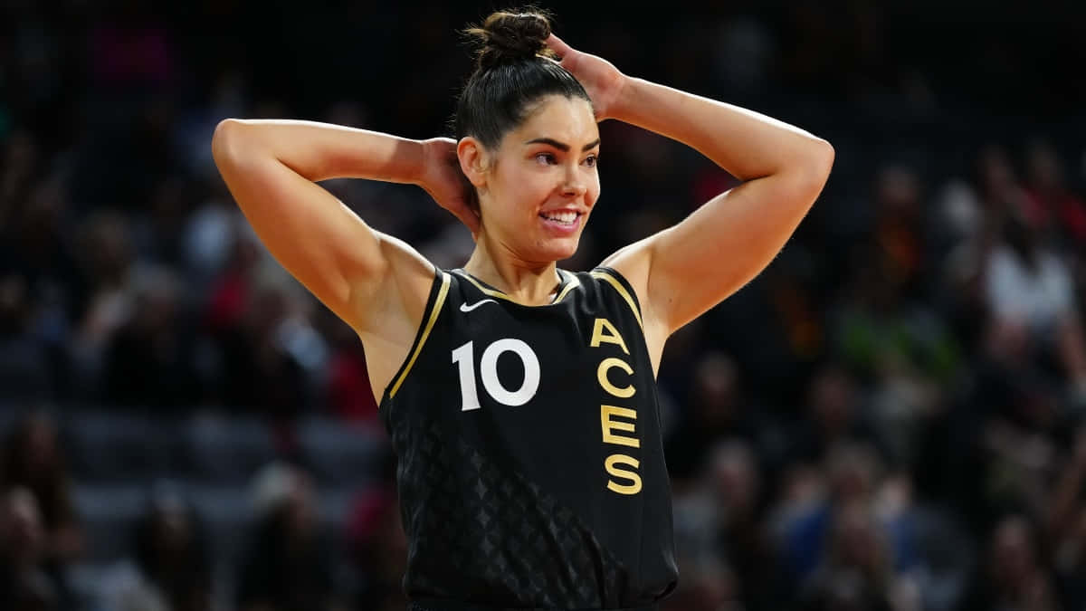 Kelsey Plum Smiling During Game Wallpaper