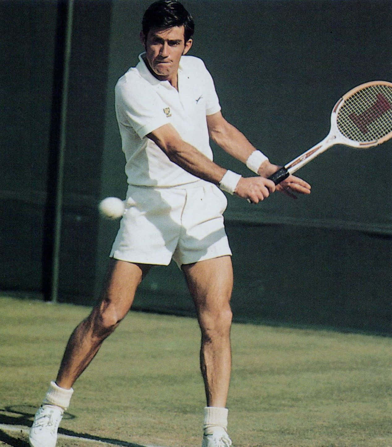 Ken Rosewall Executing An Impressive Tennis Shot Wallpaper