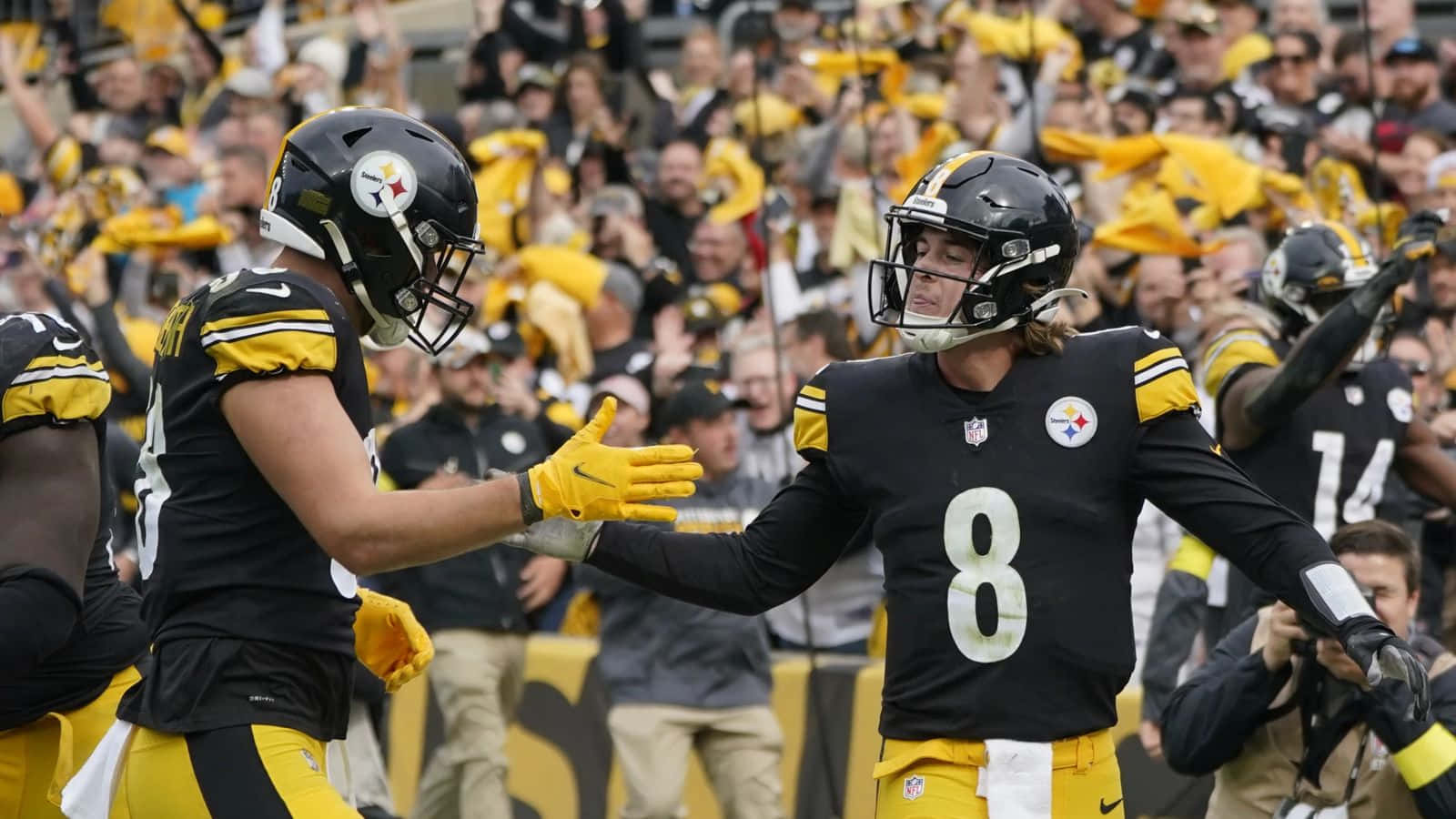 Kenny Pickett Celebratingwith Teammate Wallpaper