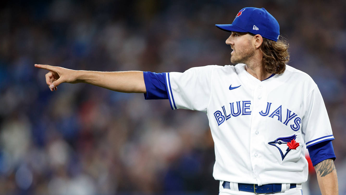 Kevin Gausman Wearing A White And Blue Jersey Wallpaper