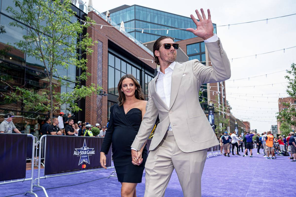 Kevin Gausman With His Wife On Purple Carpet Wallpaper