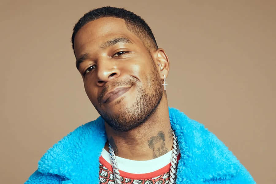 Kid Cudi Smilingin Blue Fur Coat Wallpaper