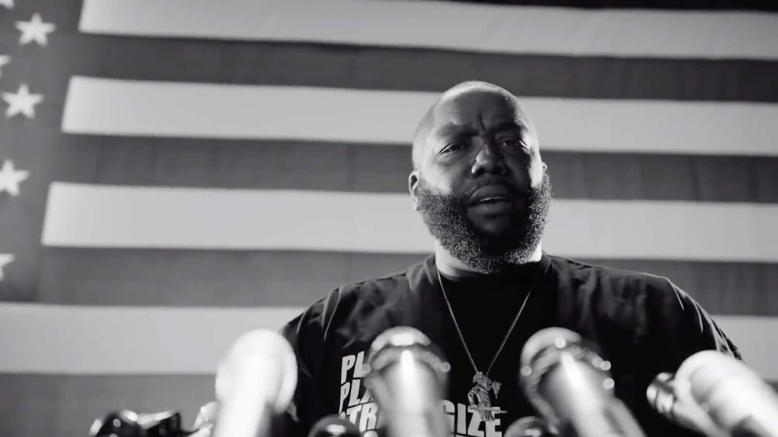 Killer Mike Speakingat Podium Wallpaper