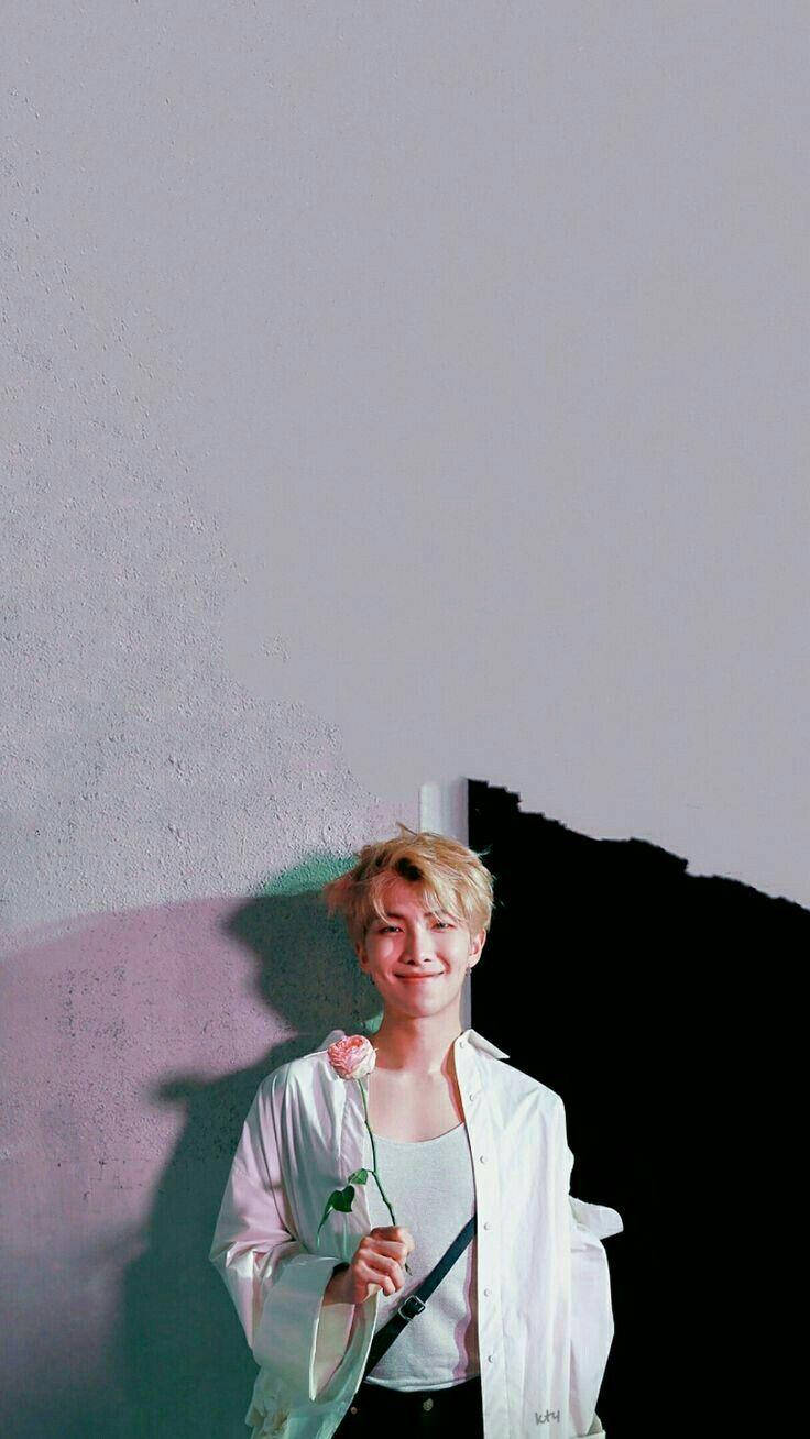 Kim Namjoon Holding A Rose Wallpaper