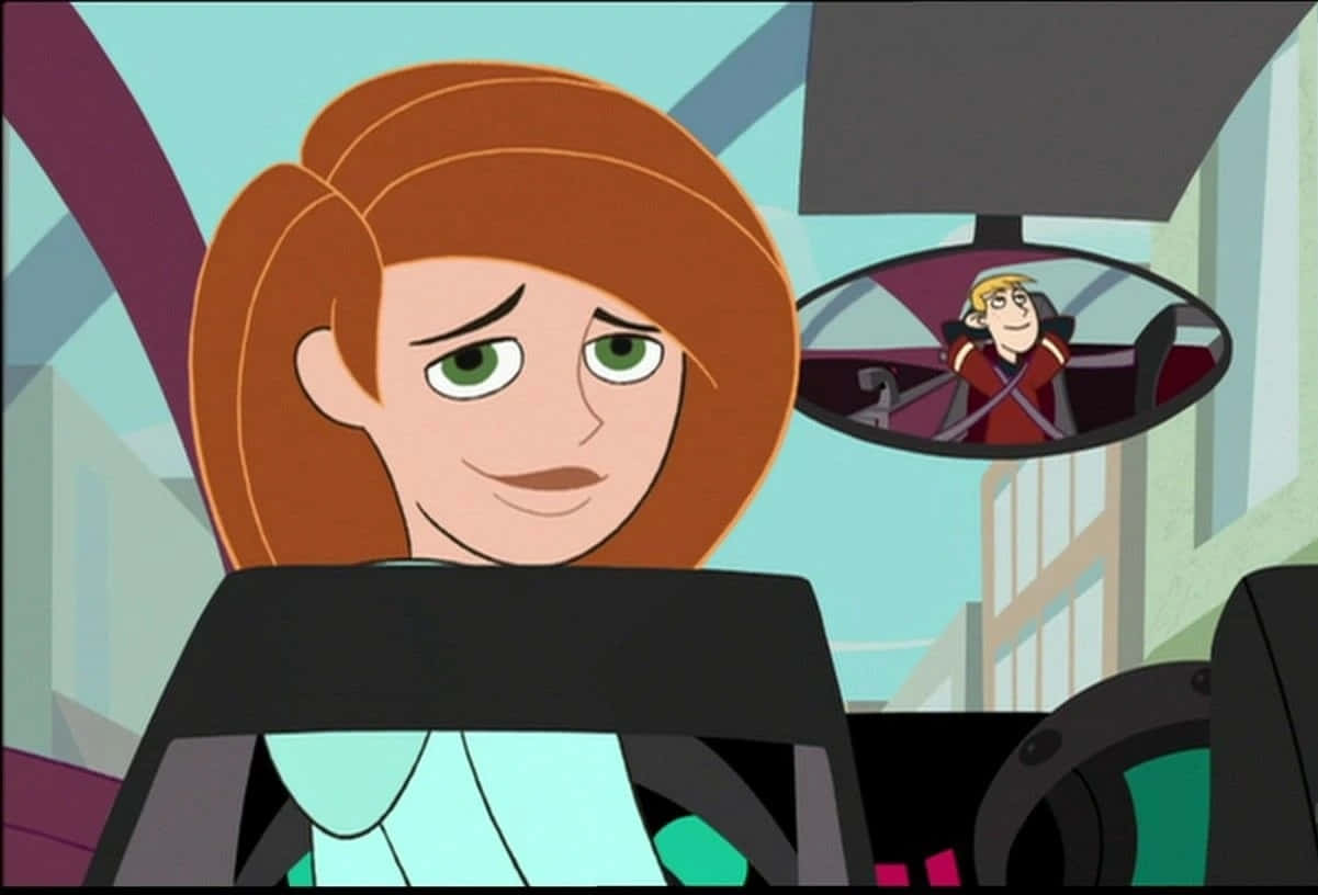 Kim Possible And Ron Stoppable In Action Wallpaper