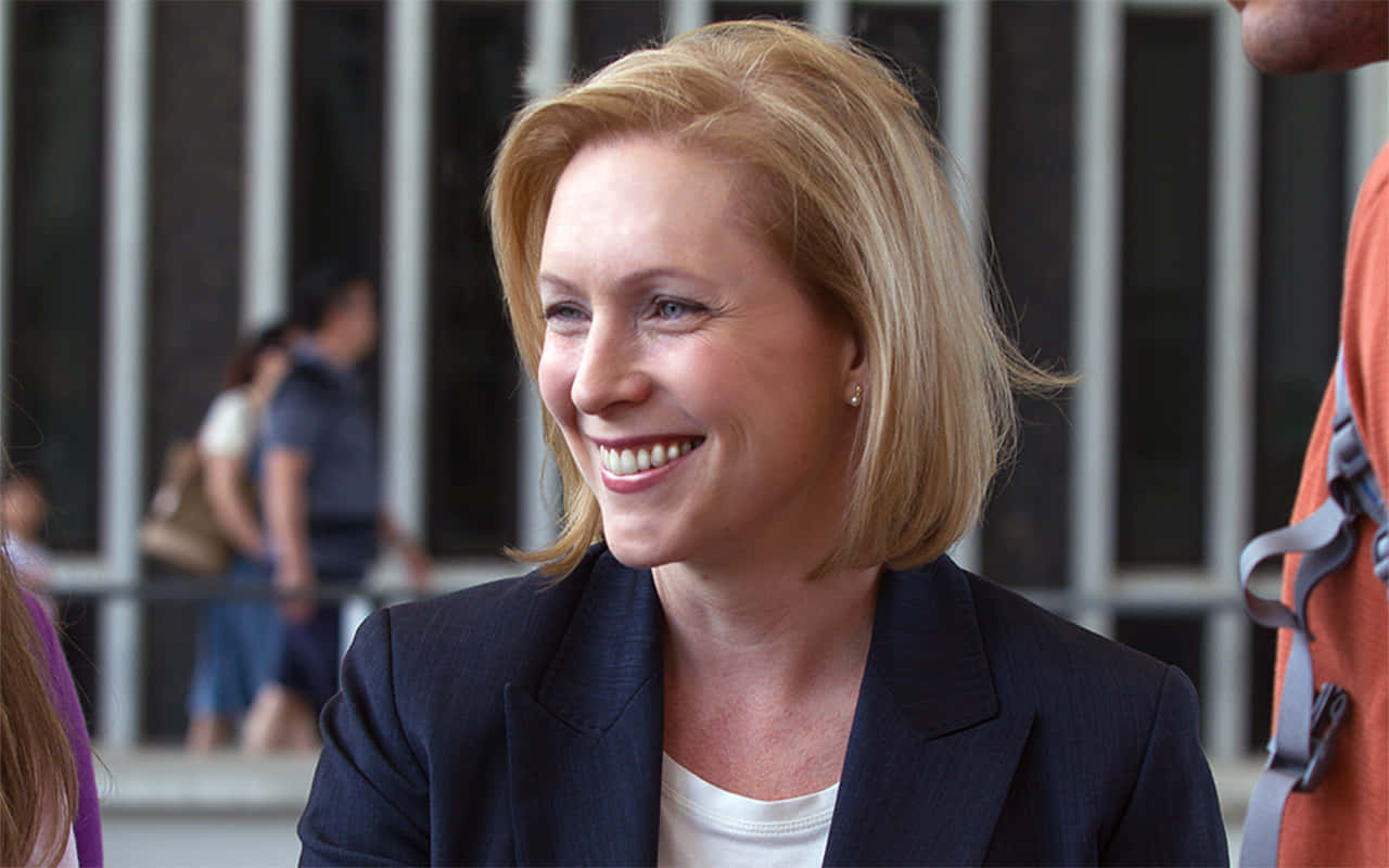 Kirsten Gillibrand Smiling Outside Wallpaper