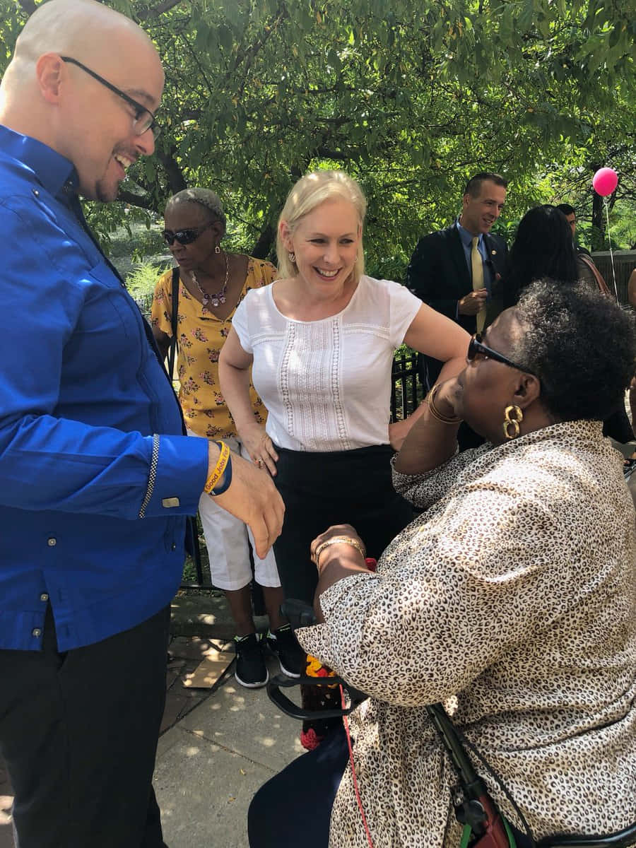 Kirsten Gillibrand With People Outside Wallpaper