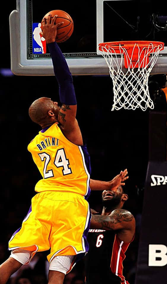 Kobe Bryant Demonstrating One Of His Trademark Dunks. Wallpaper