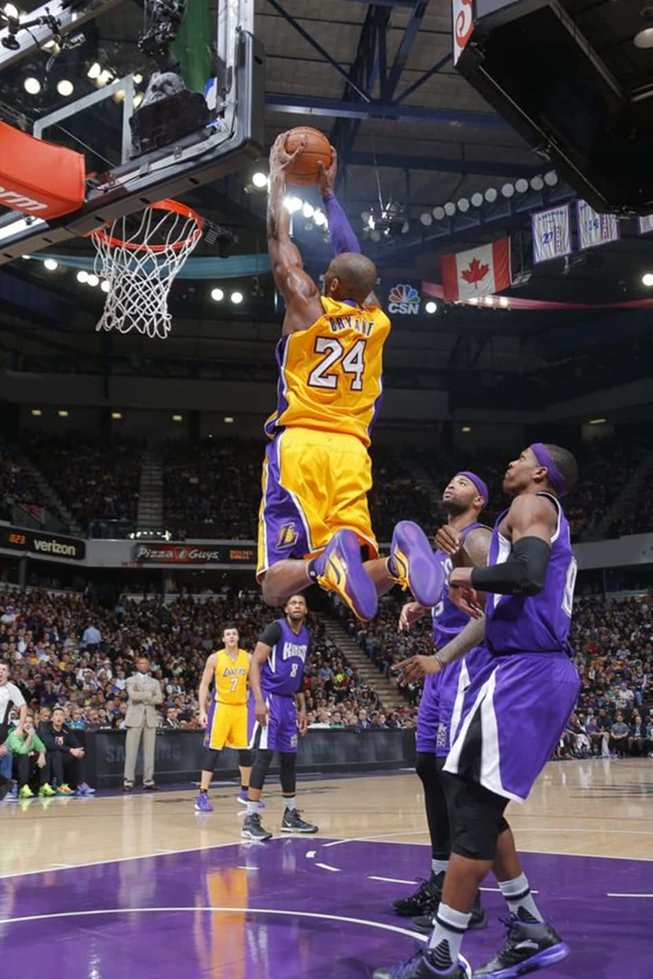 Kobe Bryant Dunks Over A Defender Wallpaper