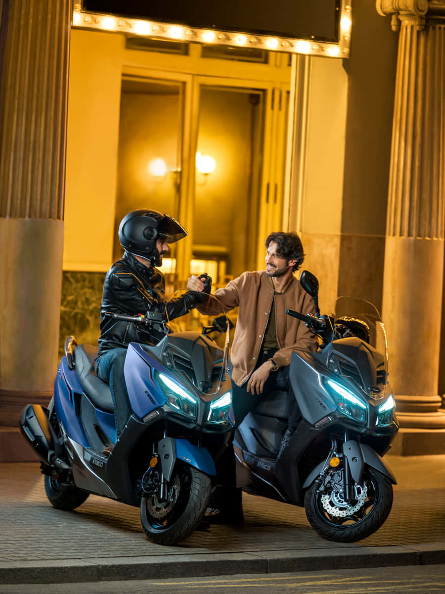 Kymco Scooters Nighttime Cityscape Wallpaper