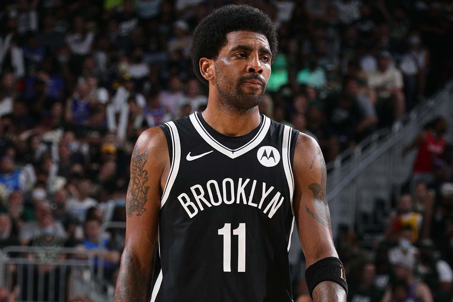 Kyrie Irving Hustles Down The Court In Brooklyn Nets Jersey Wallpaper