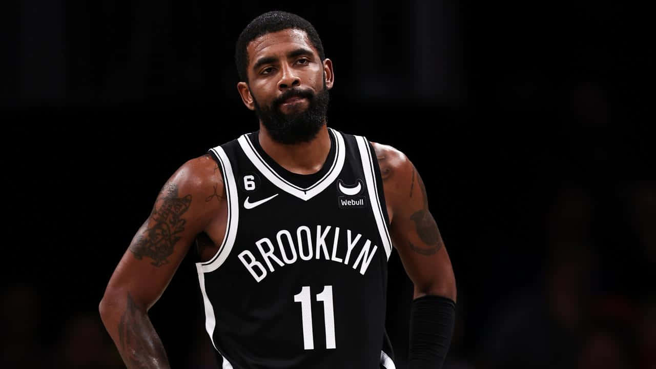 Kyrie Irving Looking Sharp In A Brooklyn Nets Uniform Wallpaper