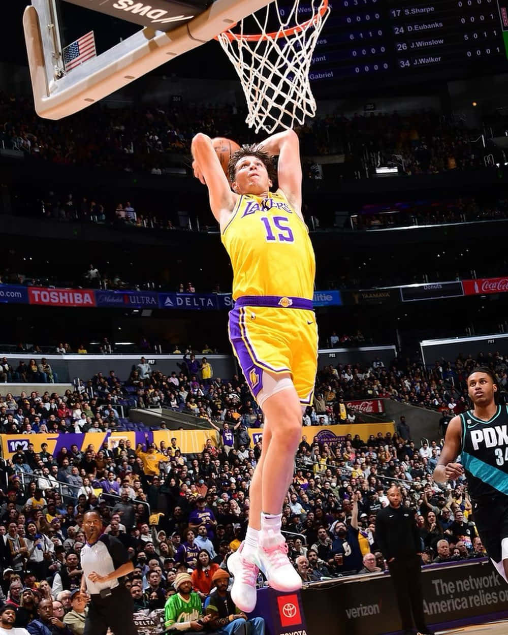 Lakers Player Dunking During Game Wallpaper