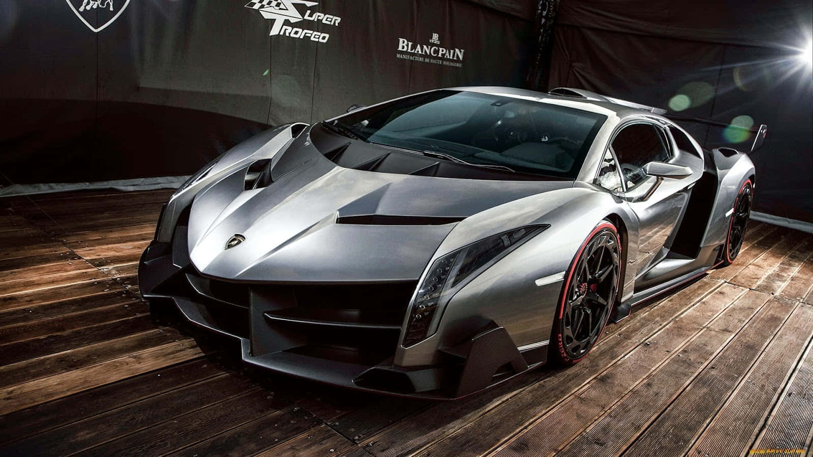 Lamborghini Veneno Speeding Down The Road Wallpaper