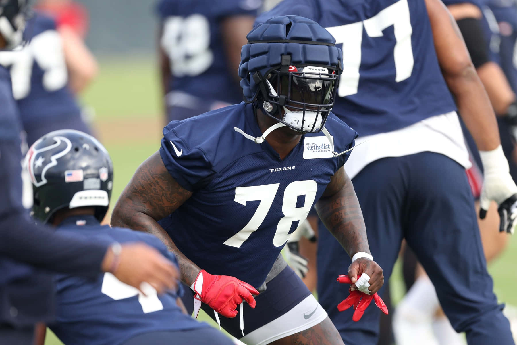 Laremy Tunsil In Action Wearing A Dark Blue Football Kit Wallpaper