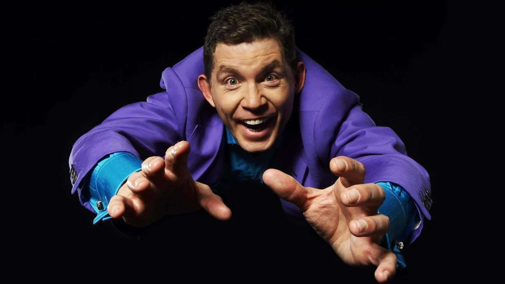 Lee Evans Performing On Stage Wallpaper