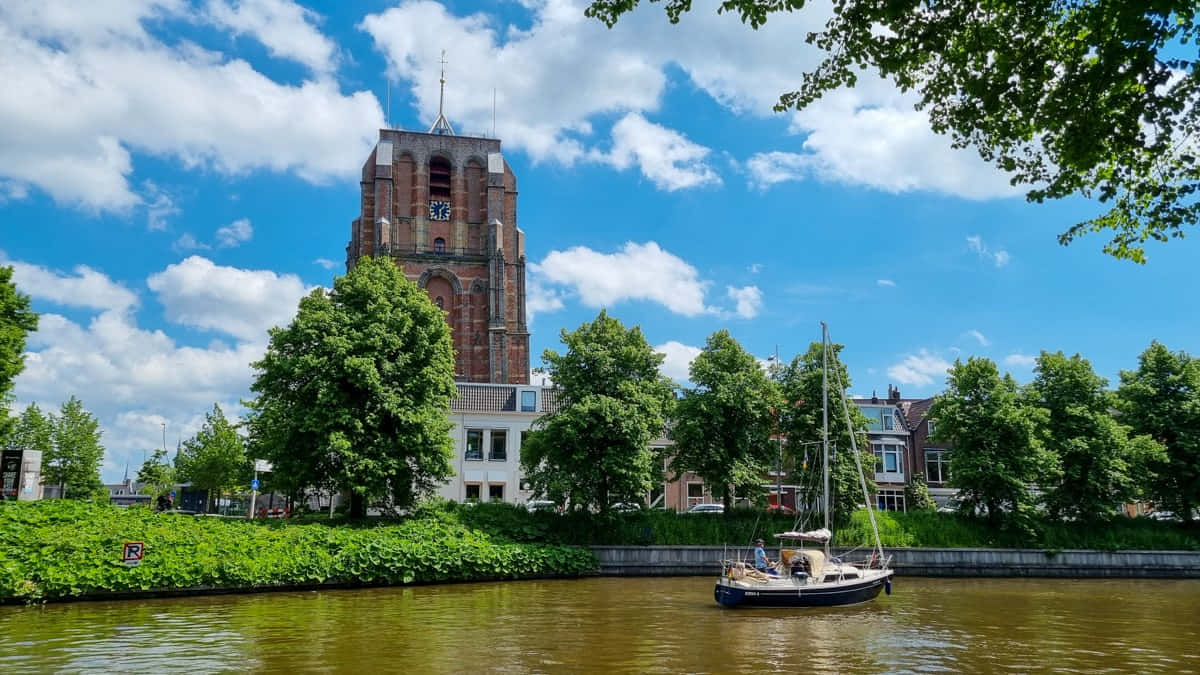 Leeuwarden Canal Viewwith Historic Church Wallpaper