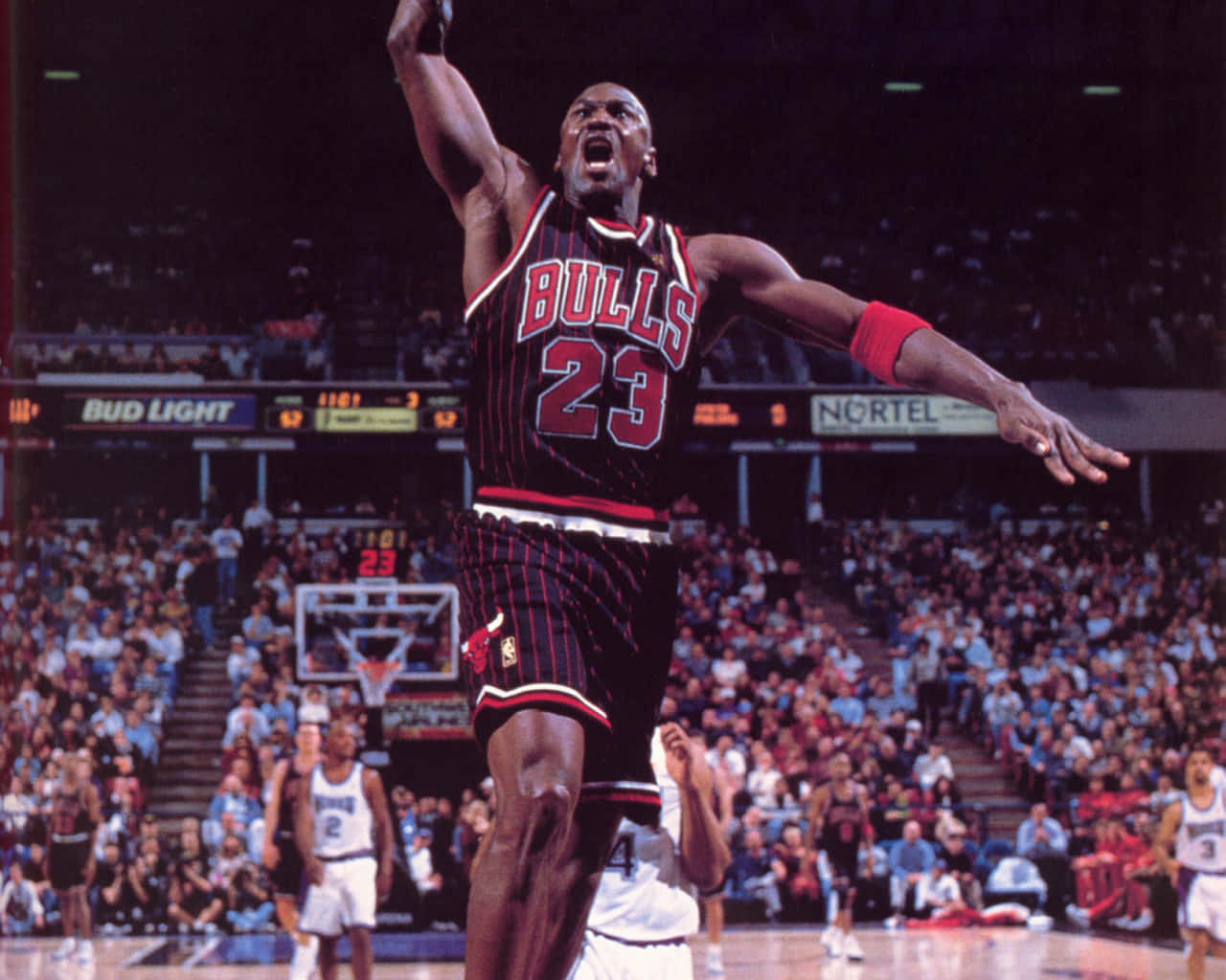 Legendary Basketball Player Michael Jordan In His Iconic Bulls Jersey Wallpaper