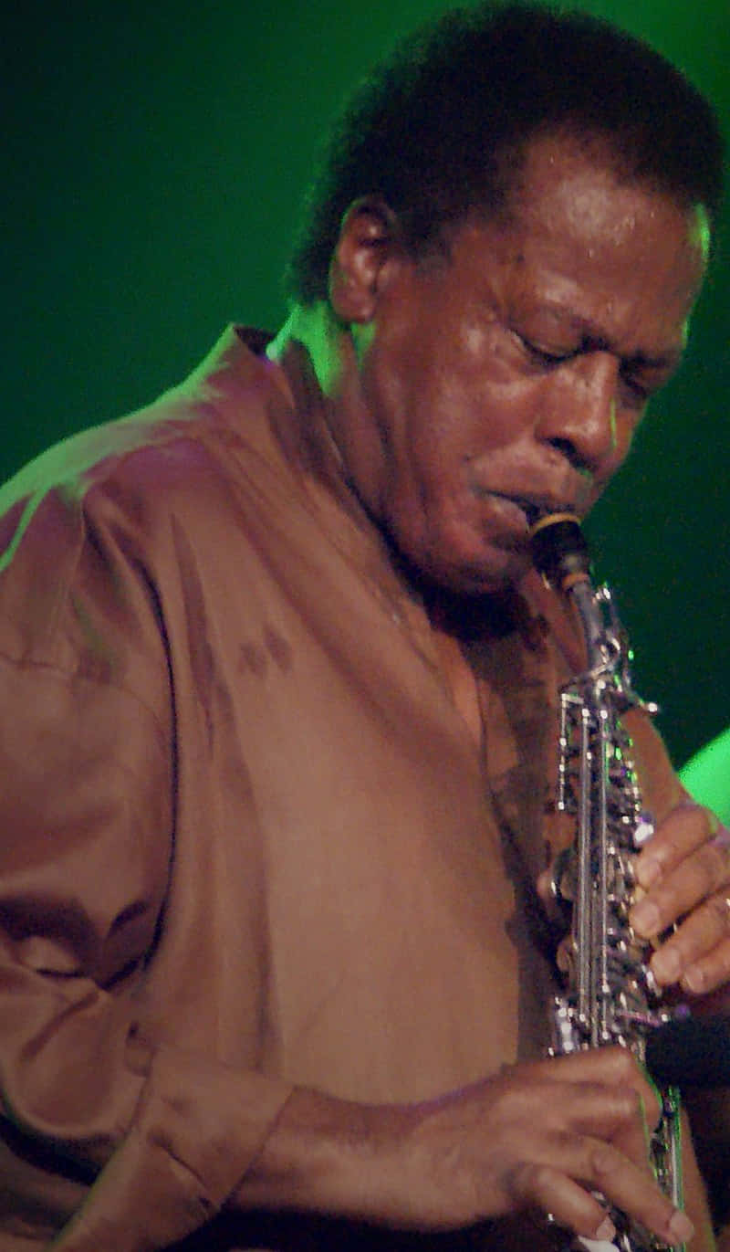 Legendary Jazz Musician Wayne Shorter On Stage Wallpaper