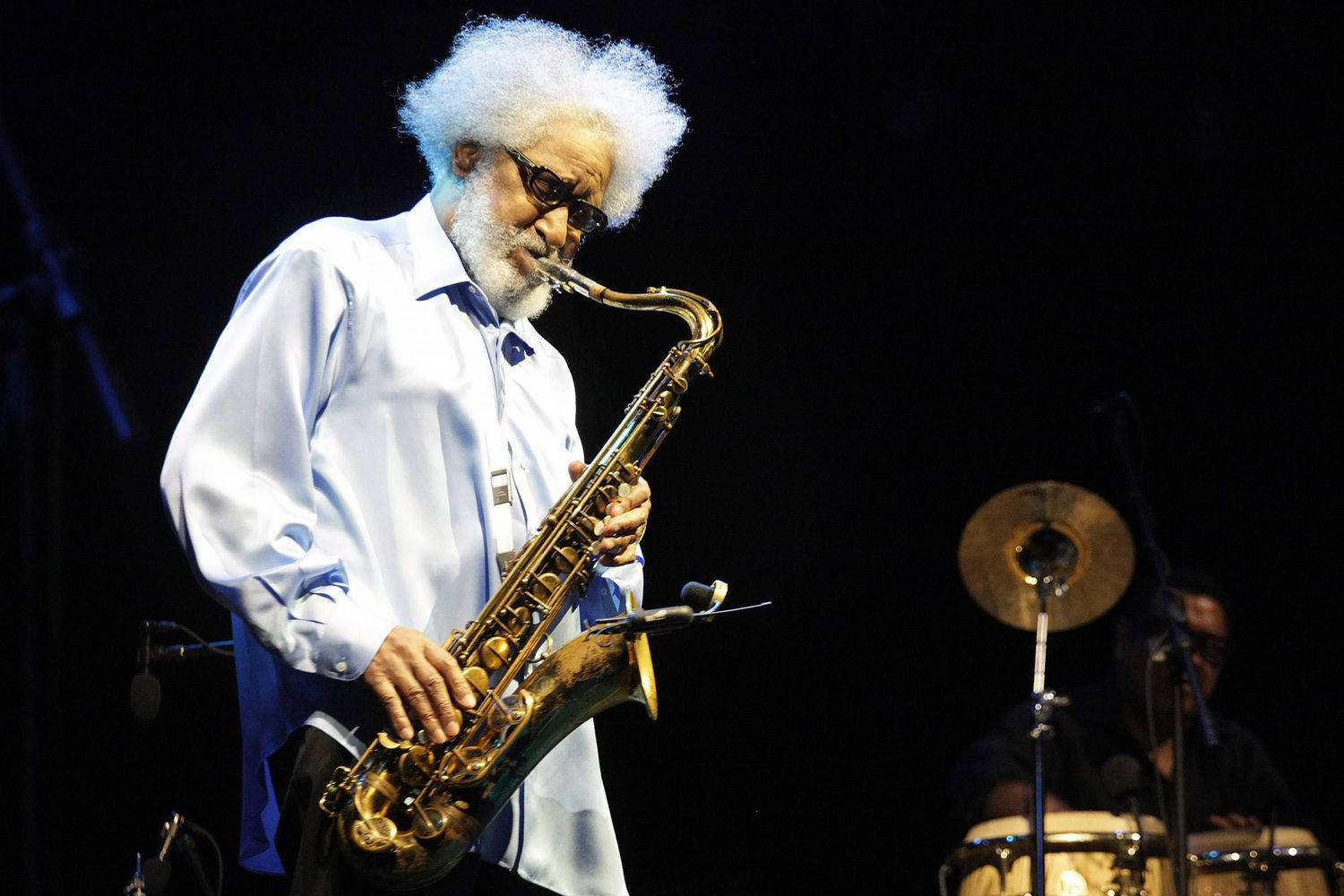 Legendary Jazz Saxophonist Sonny Rollins In Performance Wallpaper