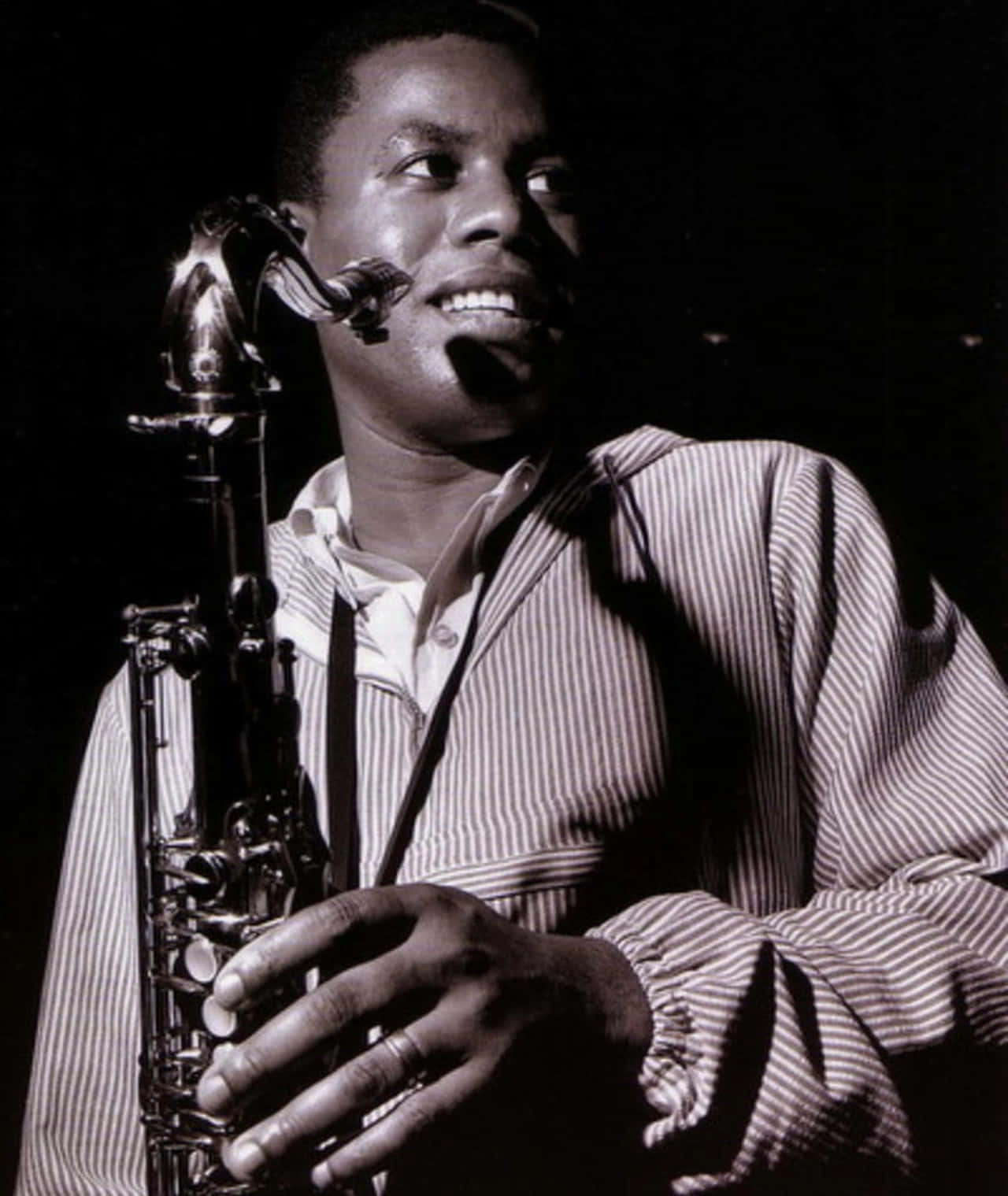 Legendary Jazz Saxophonist Wayne Shorter Performing On Stage Wallpaper